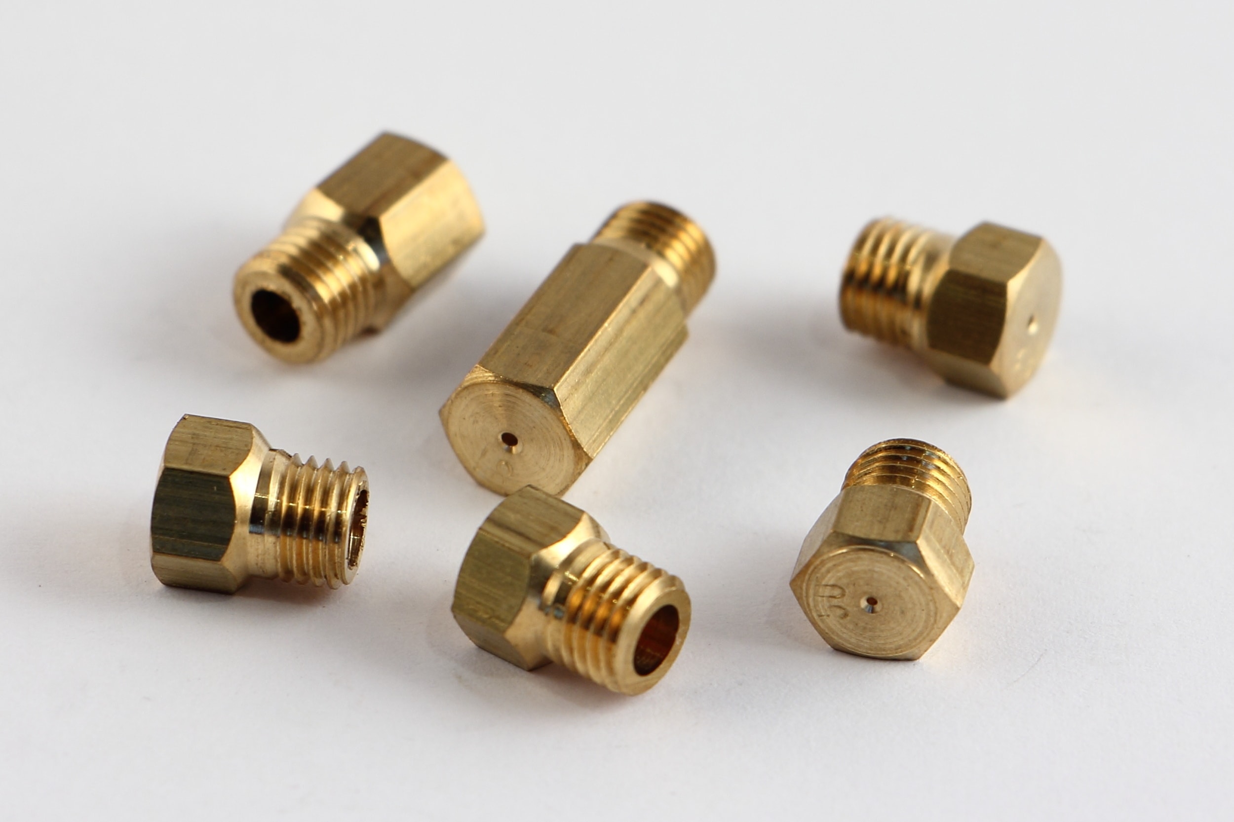 Replaceable gas nozzles for gas stove for different pressure mag