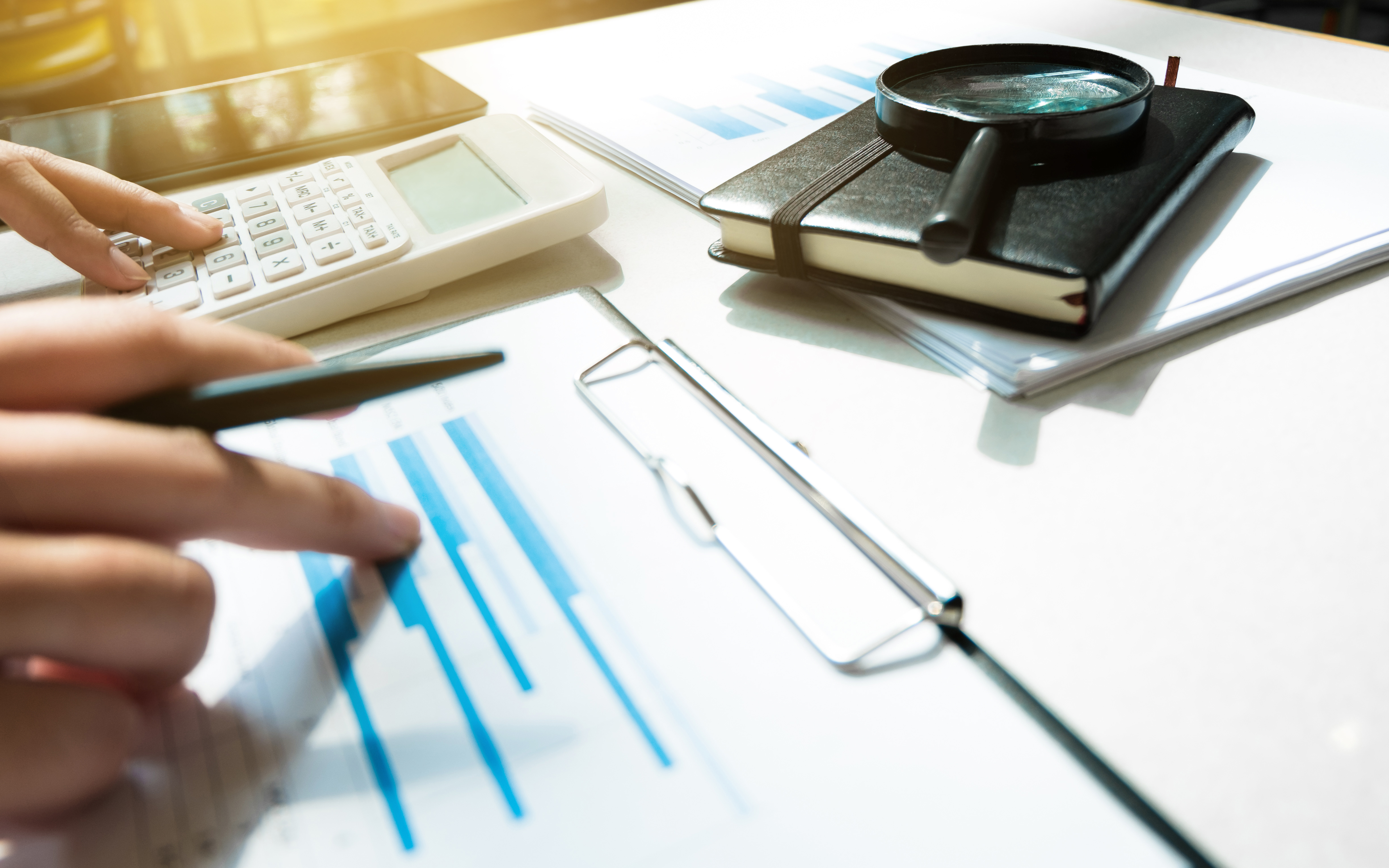 Financial accounting Business woman using calculator while point