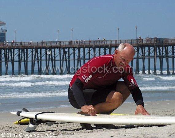 Man Waxing Surfboard, Oceanside, California(4285)
