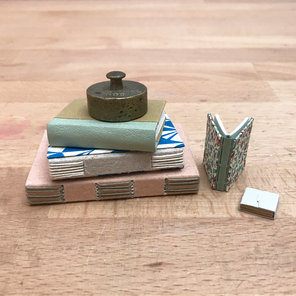 // Macro to Micro Miniature Bookbinding Herringbone Bindery