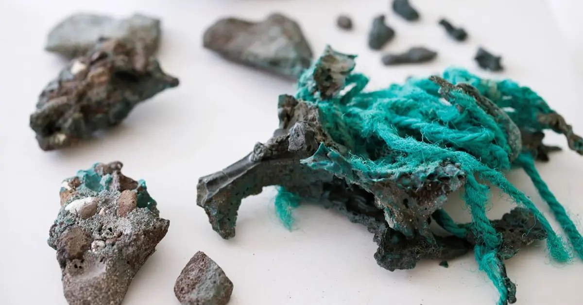 Why are plastic rocks found across 5 continents, and what are the