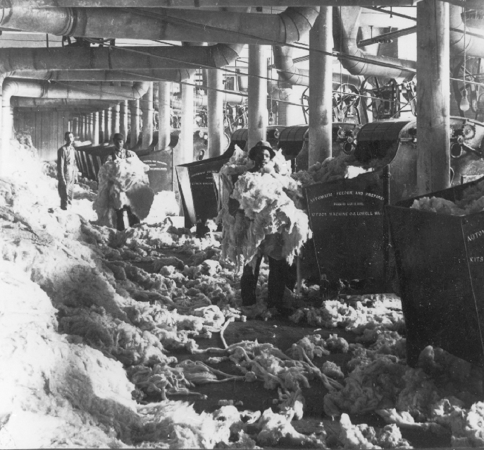 Men opening bales of cotton at the White Oak Mill in Greensboro, North