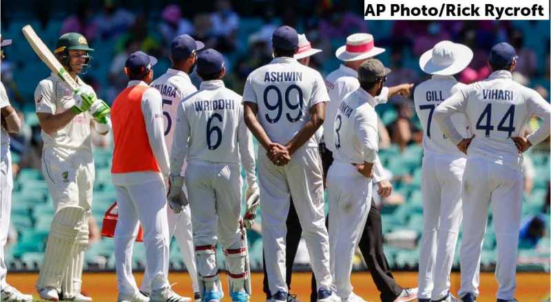 Justin Langer praised Tim Paine as he joined India's huddle after the abuse