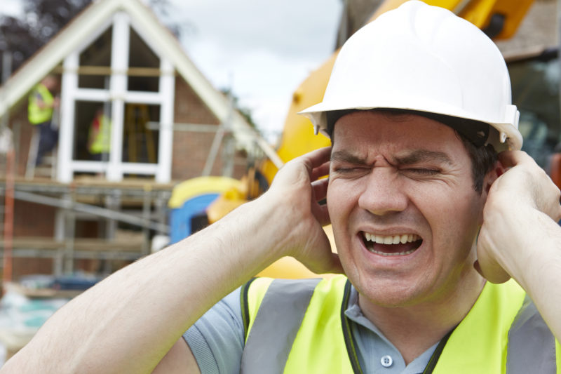 Construction Suffering From Noise Pollution On Building Site Injured