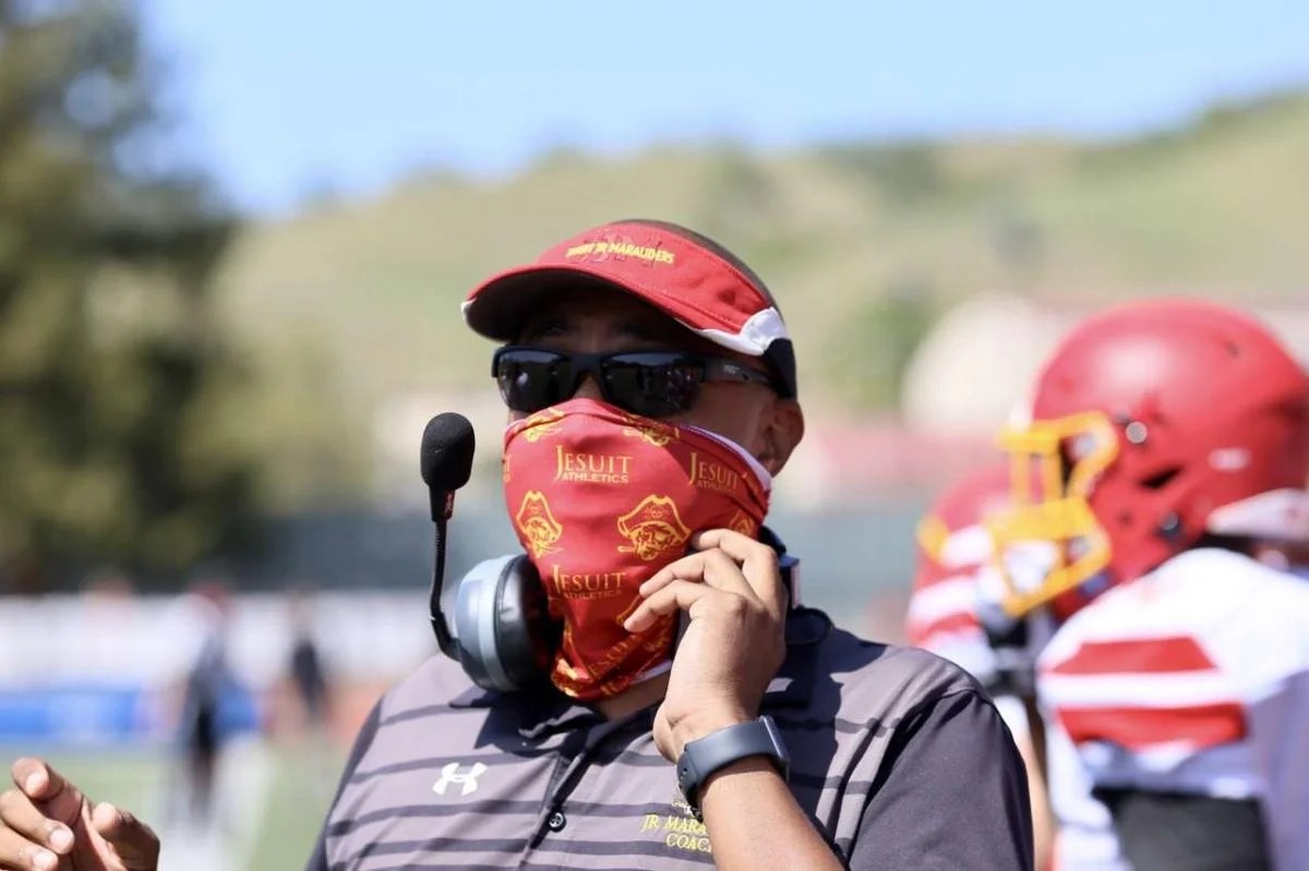 Coach Chris Lee fills in as JV football coach Jesuit High School