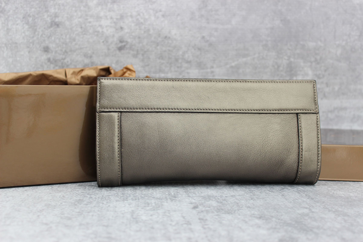 Gucci pewter & gold leather Starlight interlocking GG clutch