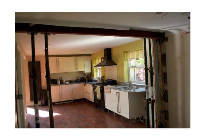 How much does it cost to knock down a load bearing wall? John Webster