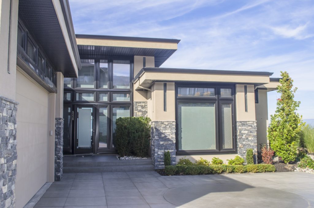 Kelowna Home with Linear Design and Natural Stone