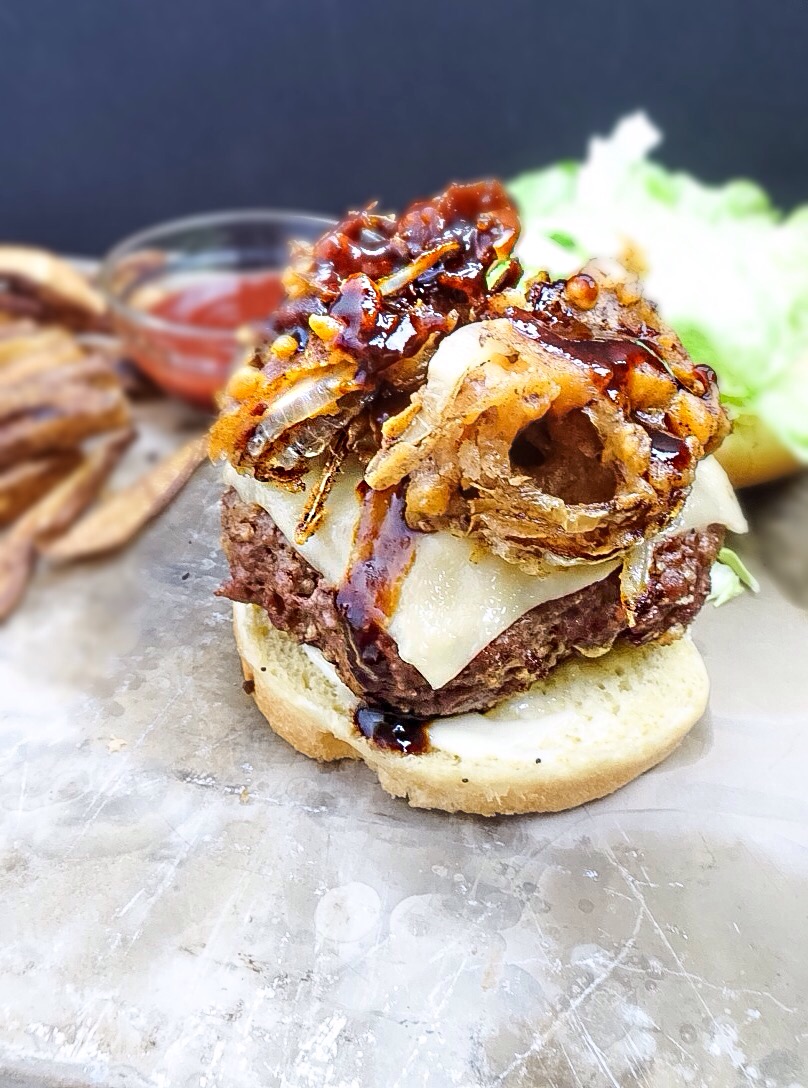 Spicy Cheddar Stuffed Burgers Topped With Fried Onions Kellie Rice Cakes