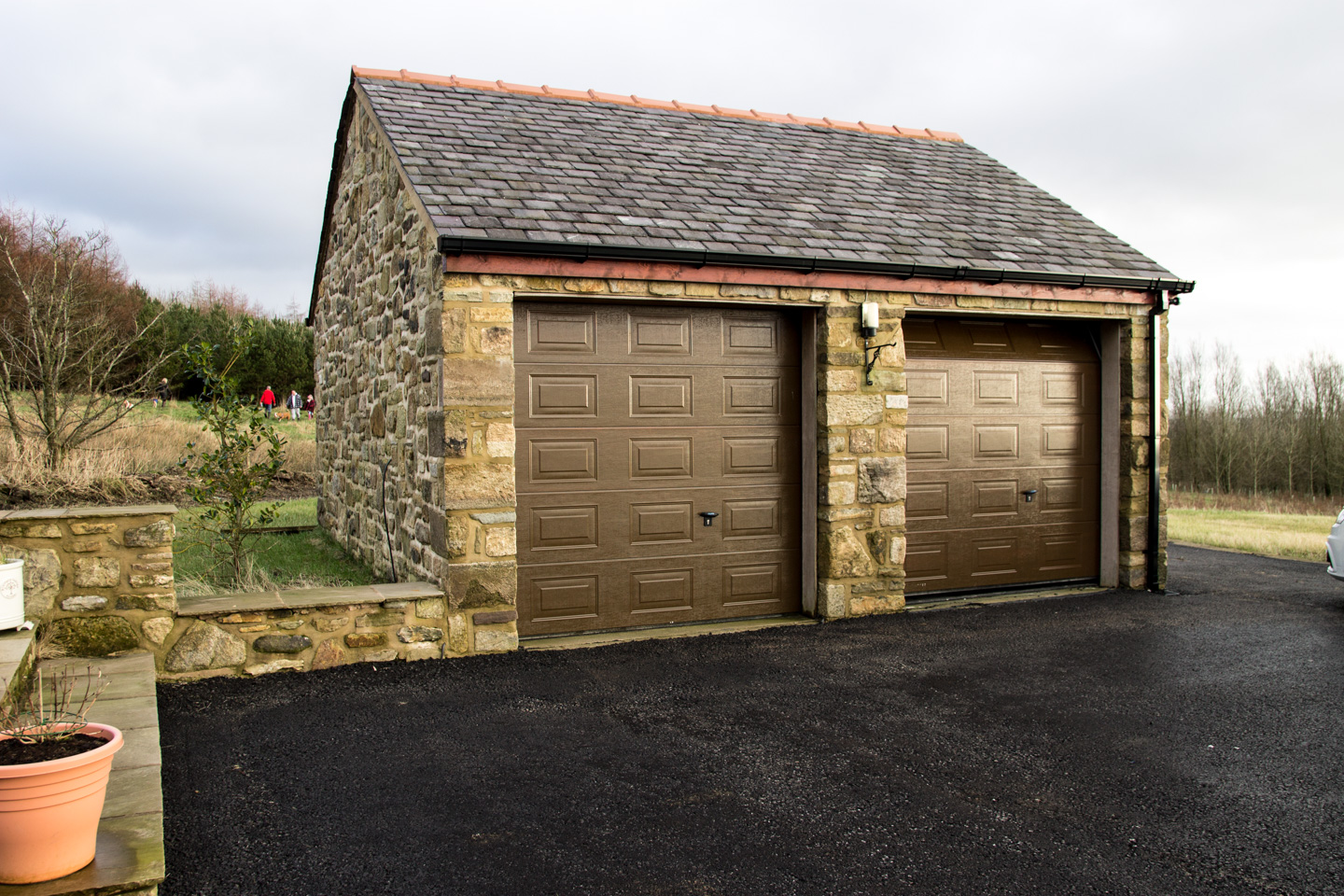 Random stone new build project with garage Portfolio