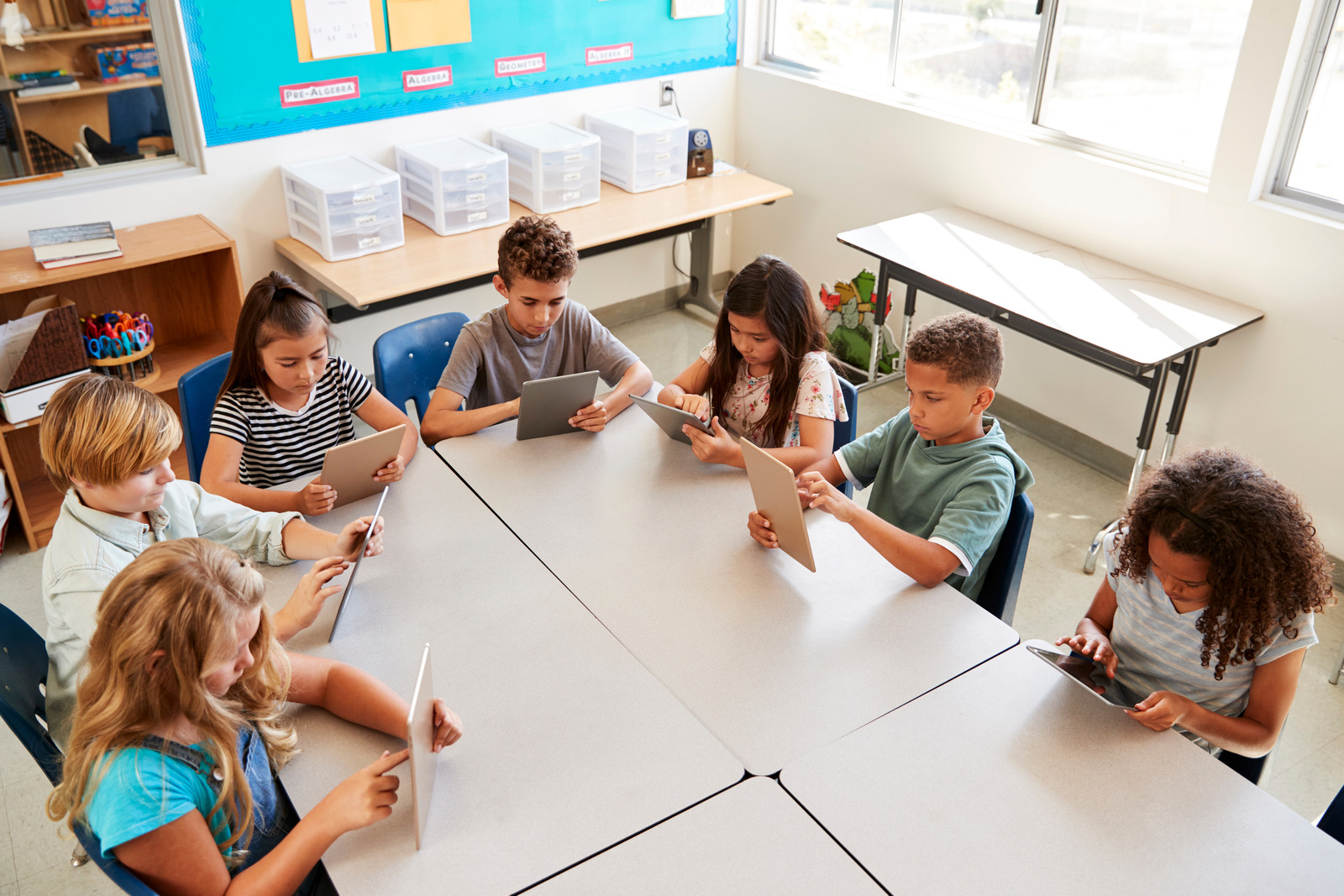 Young kids using tablets in school lesson, elevated view KidsProef