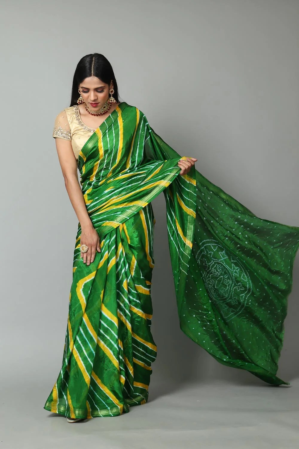 Green & Yellow Lehariya saree in Silk fabric with zari border and