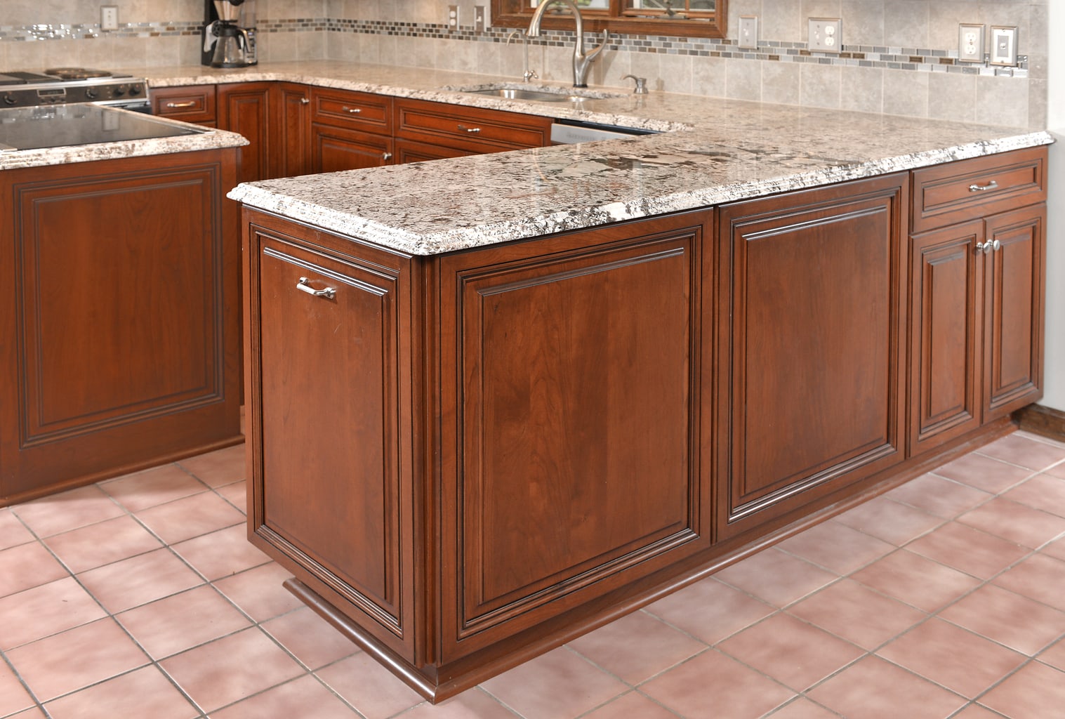 This Manassas, Virginia kitchen was refaced in cherry wood. The raised