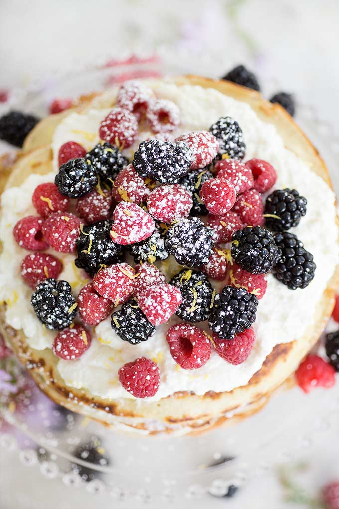 Step-by-step Breakfast Crepe Cake - a simple breakdown of how to make a perfect breakfast crepe cake! Raspberry and lemon ricotta between layers of crepes!