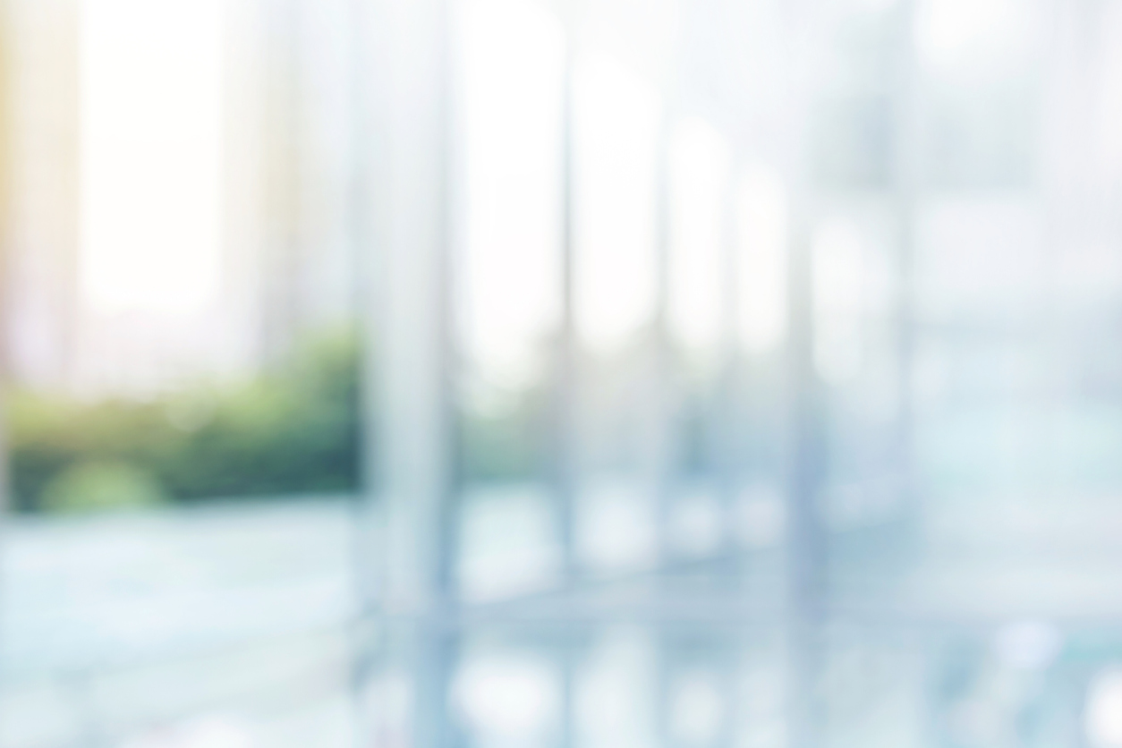 Blurred abstract grey glass wall building background. KnowledgePoint