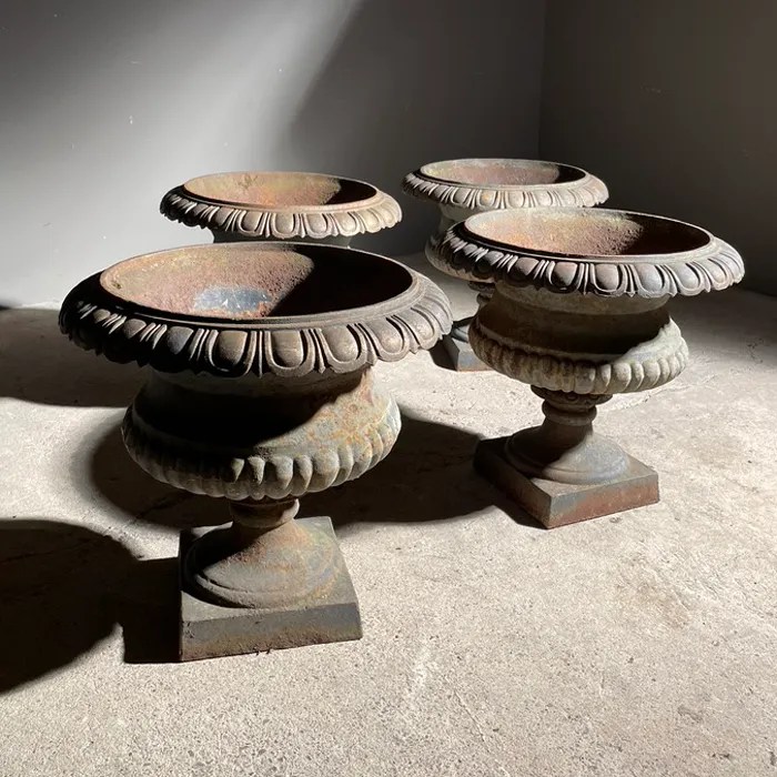 A set of four French castiron terrace urns, LASSCO England's prime