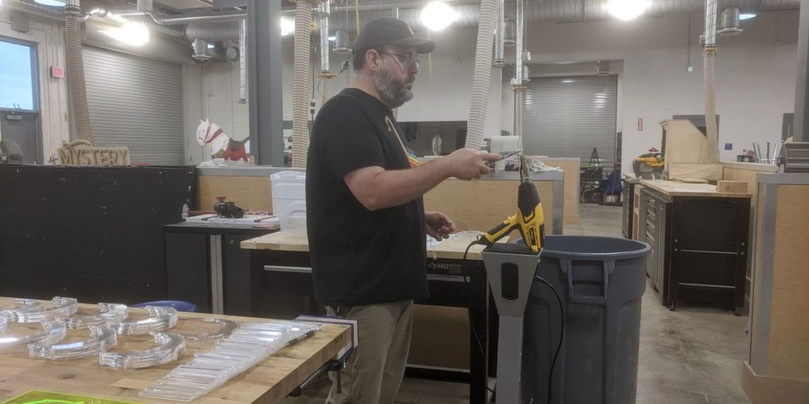 Teacher designs and makes 500 face shields for emergency workers on