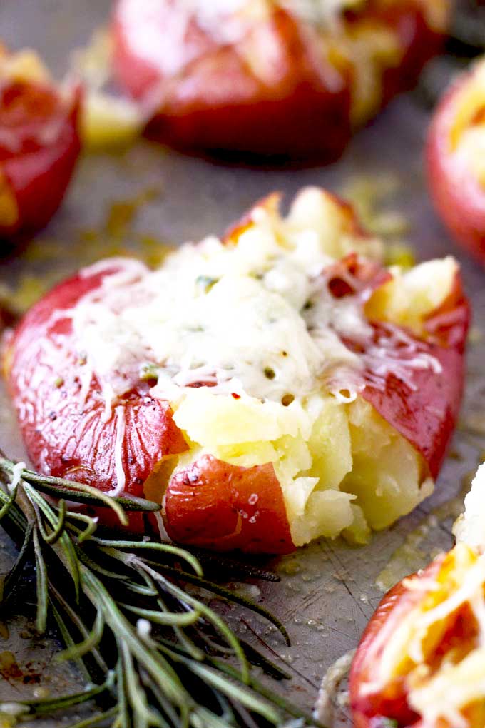 Cheesy Smashed Potatoes with Garlic and Herb Lemon Blossoms