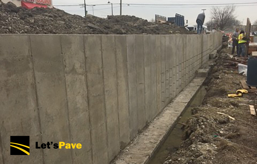 Retaining Wall Excavation & ReBuild by Let's Pave
