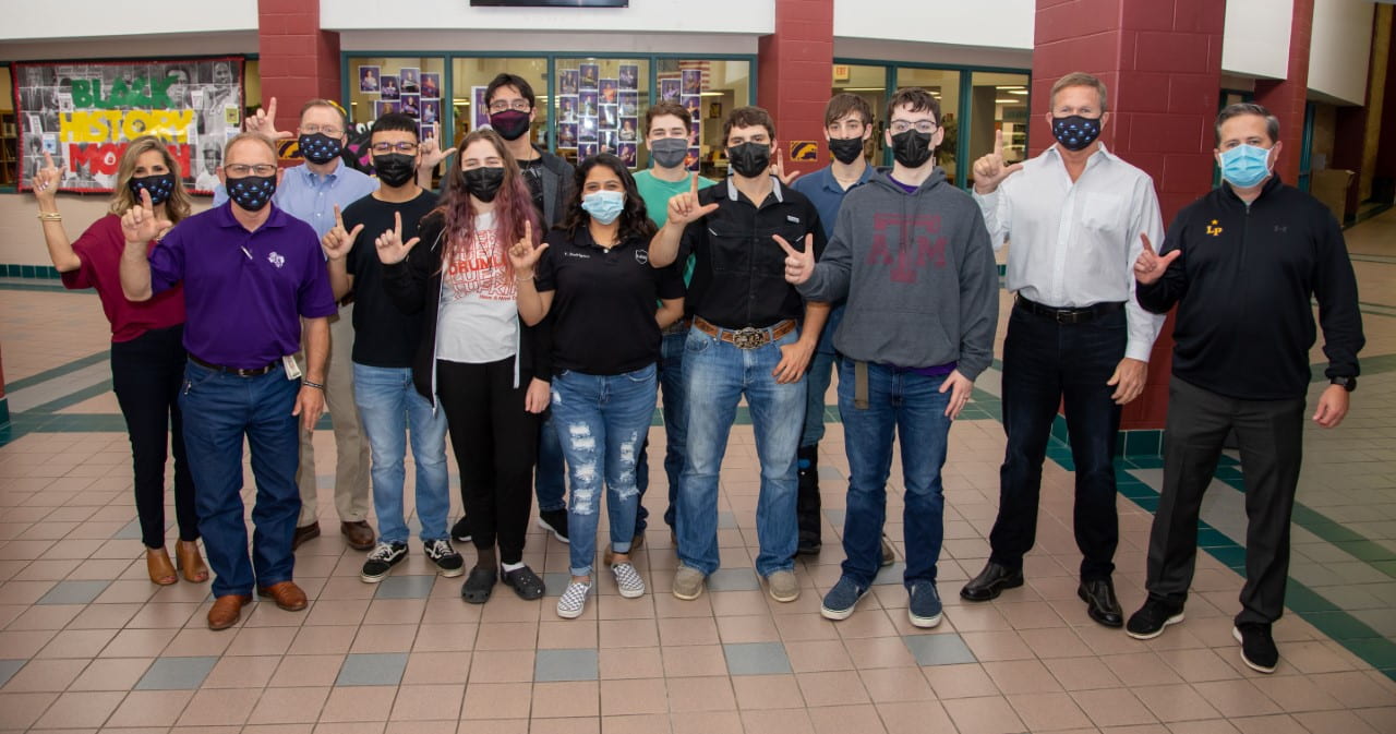 presents check to LHS CTE Department Lufkin ISD