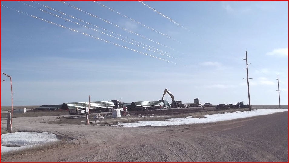Pipe is unloaded along Kirtley Road where it is being stacked for use in a new eastwest gas