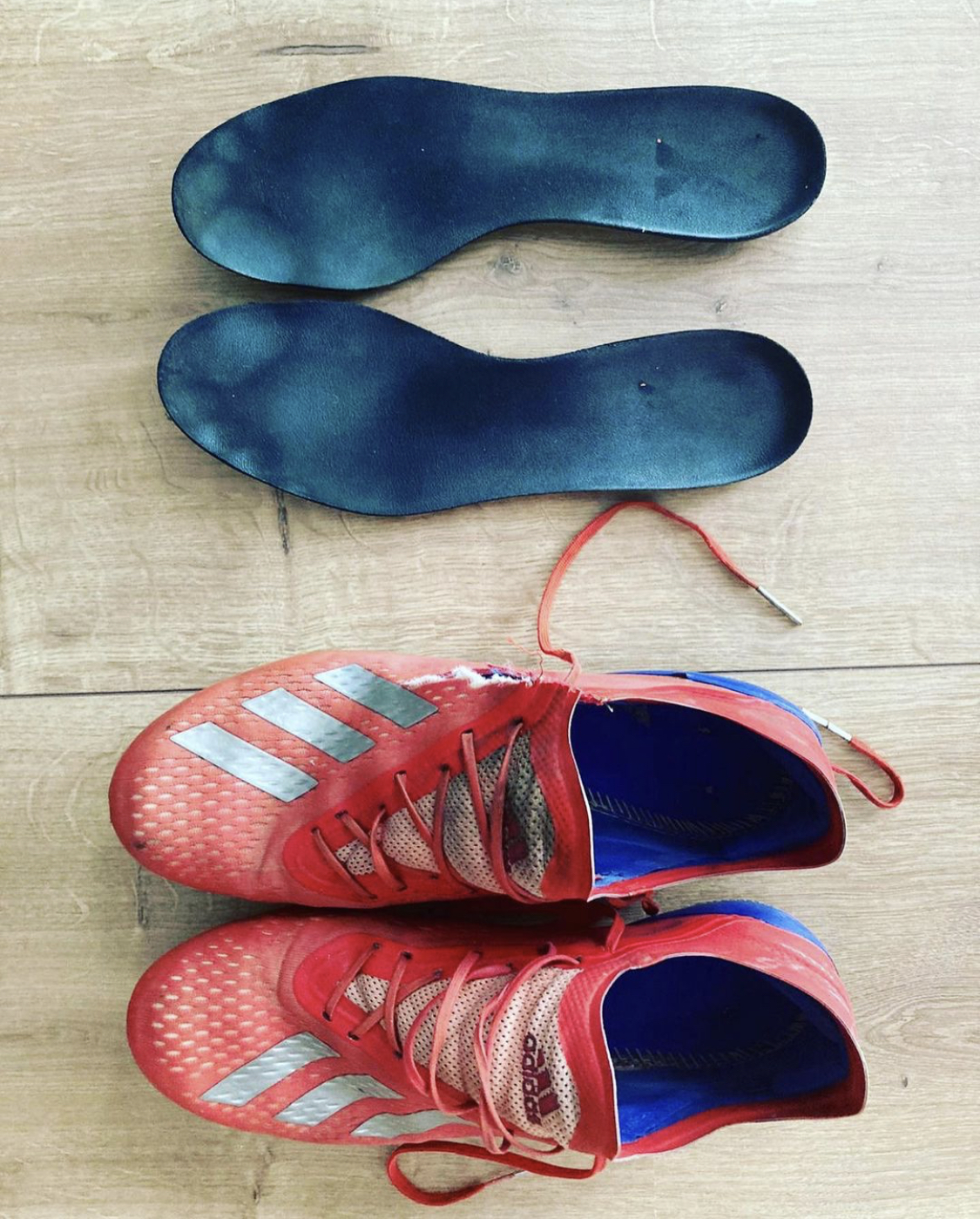 C_h1s shows off the dirty insoles of his Adidas football boots Male