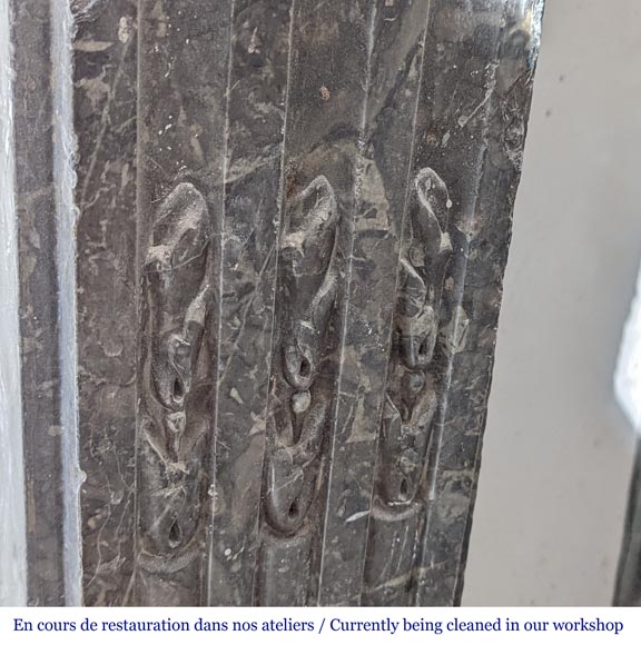 Grey Sainte Anne marble mantel with flowers and carved rosettes from