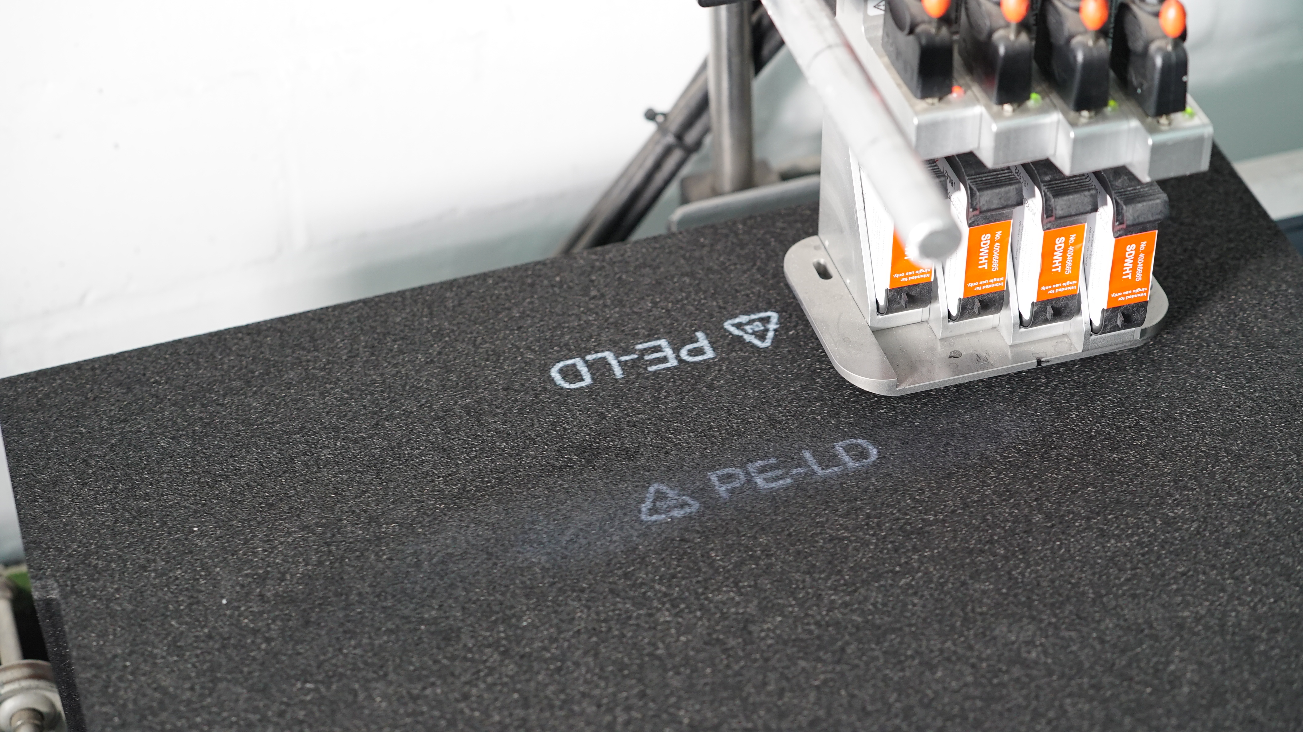 Printing on black foams with white inkjet ink