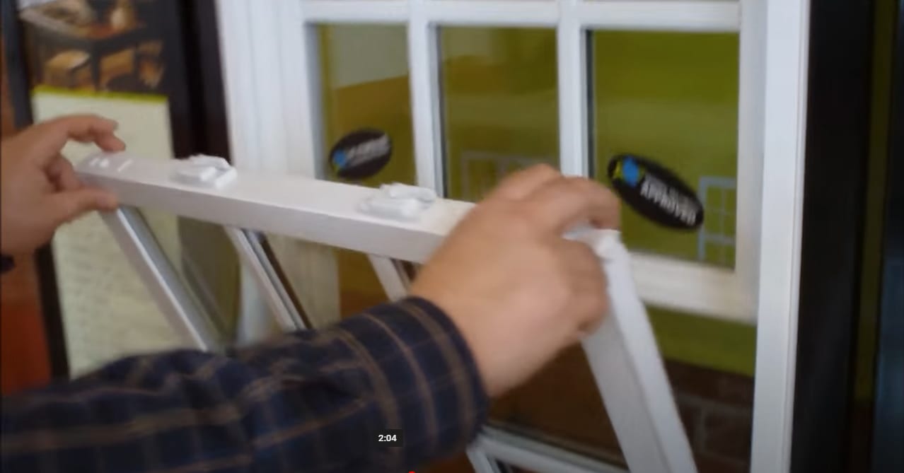 How do I tilt in my Masterview window to clean it? Master View Windows