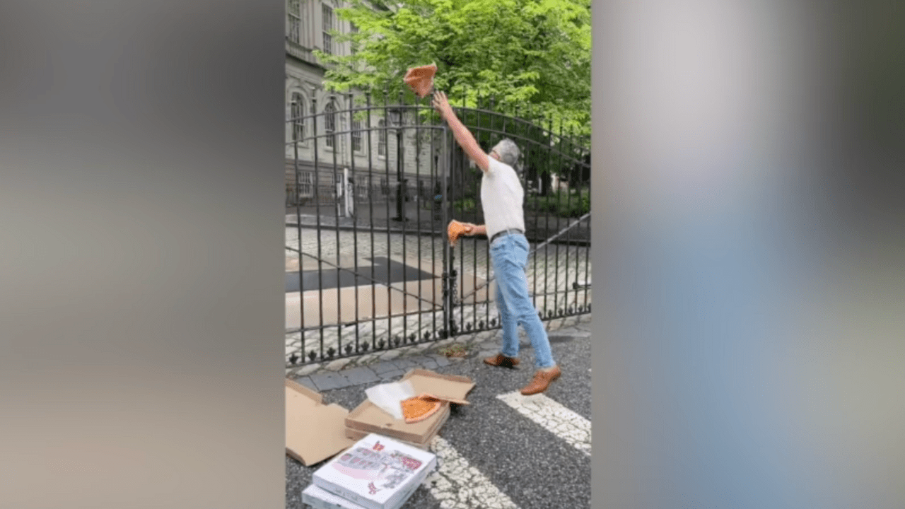 Man Throws Pizza at New York City Hall in Protest