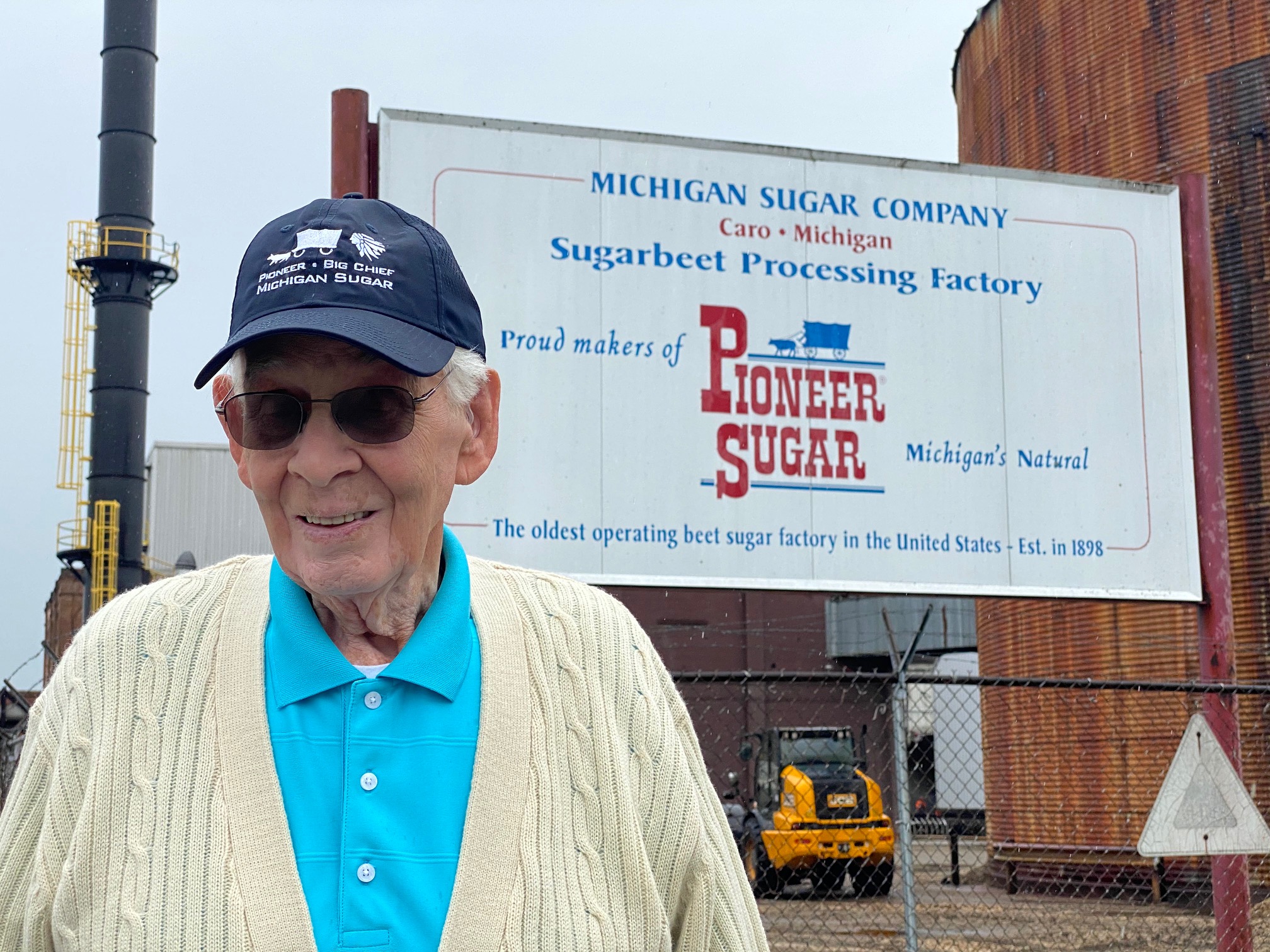 Michigan Sugar sign features old piece of farm equipment with a side of history