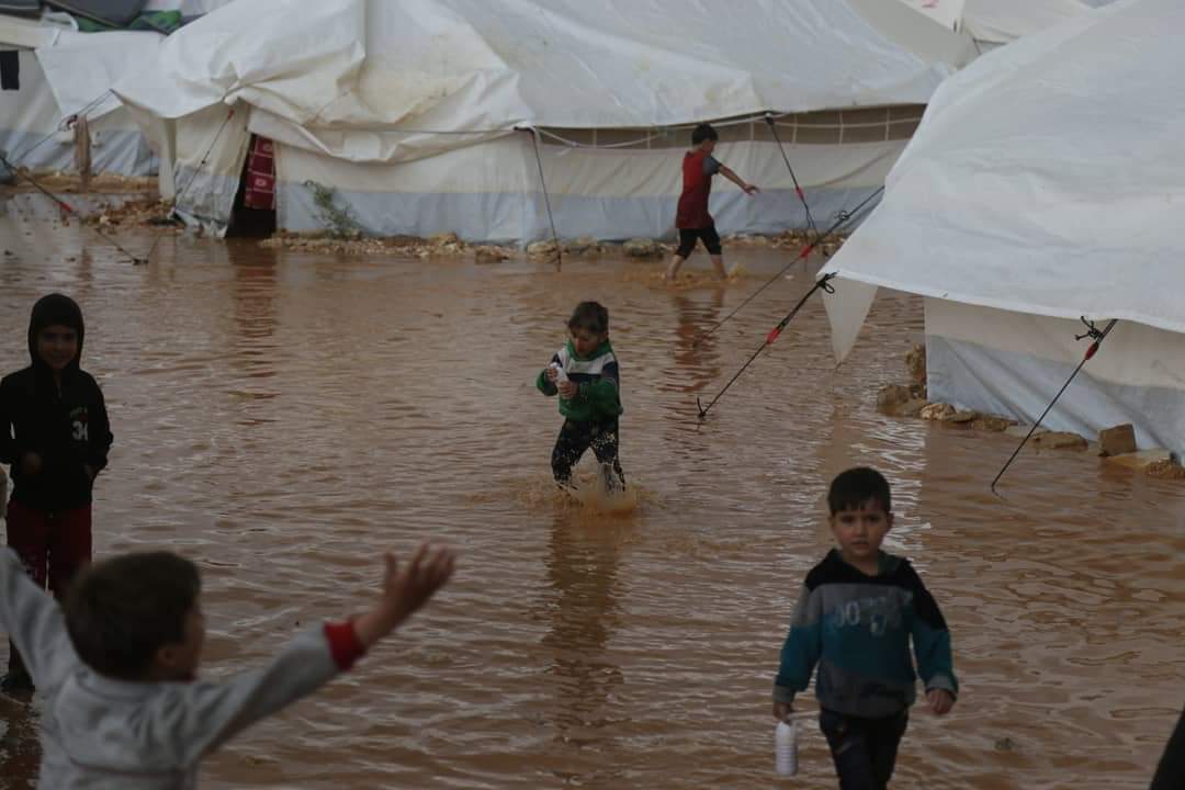 Syria refugees appeal for aid after Idlib camps flooded Middle East