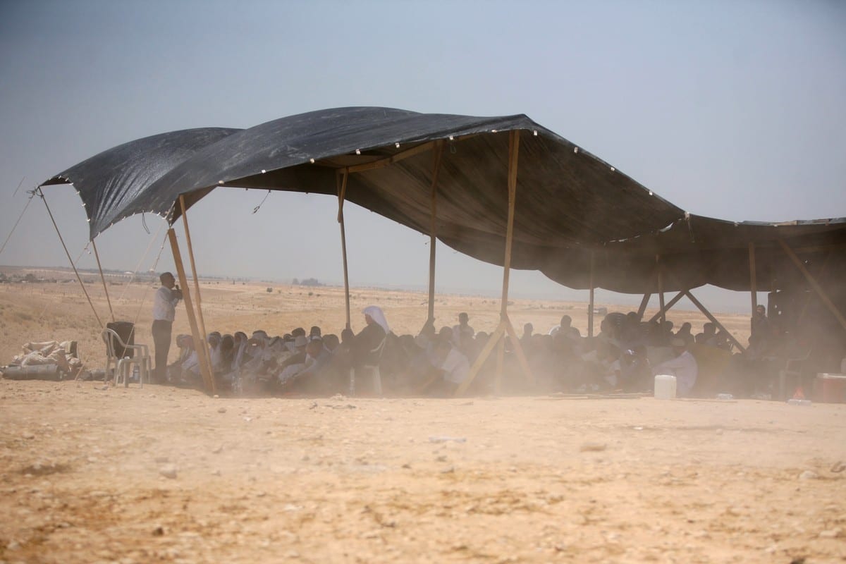 Bedouins attend Friday prayer under a tent in the Al-Araqeeb village on 14 May 2010 [HAZEM BADER/AFP/Getty Images]