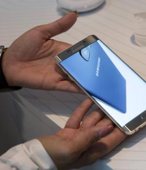 Product expert holds a Samsung Galaxy S6 Edge+ at the product's launch event in New York