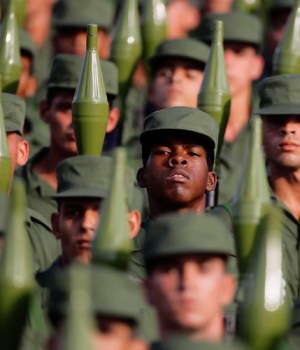 Cuban soldiers carry rocket propelled grenade launchers during a military parade in Havana's Revolution Square