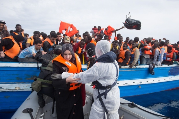 African-and-Asian-asylum-seekers-rescued-off-boats-and-taken-aboard-an-Italy-navy-ship