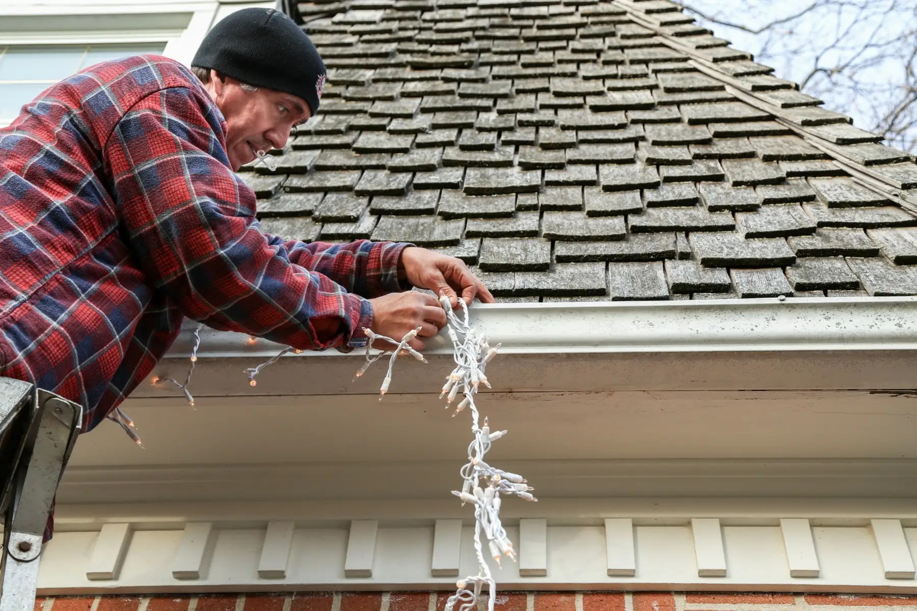 How to Hang Christmas Lights Outdoors and Indoors