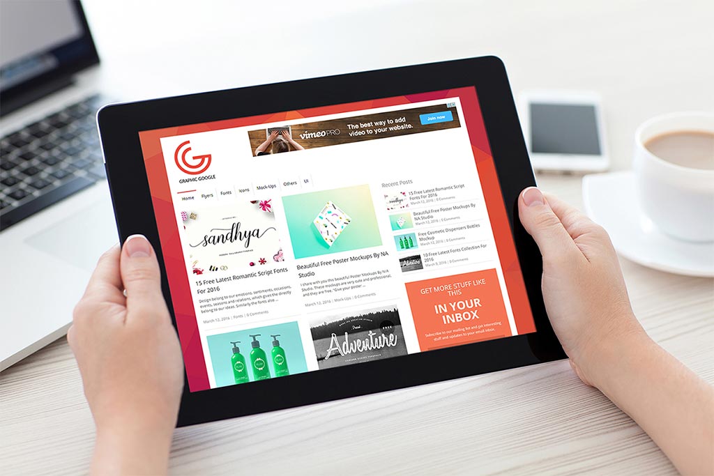 Two hands holding iPad Mockup Mockup World