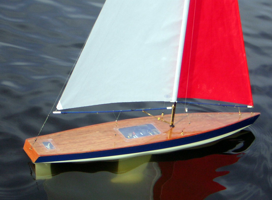radio controlled schooner and wooden toy sailboat