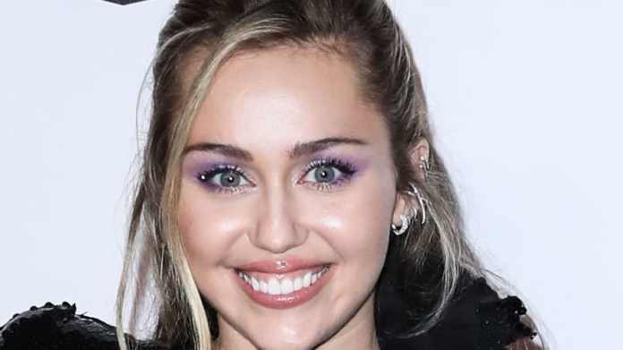 Miley Cyrus is fairly in pink for Party In The U.S.A
