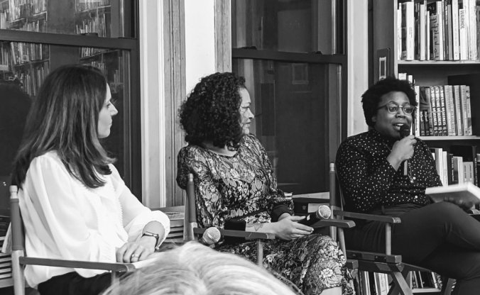 Brooke Foucault Welles and Sarah J. Jackson look on as I talk into the mic at our book tour launch at the Strand Bookstore in New York City.