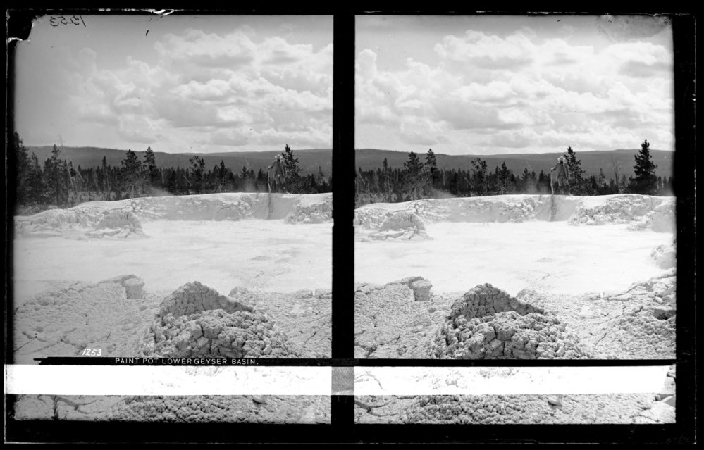 Paint pot, Lower Geyser Basin (man leaning on stick), Fountain Paint