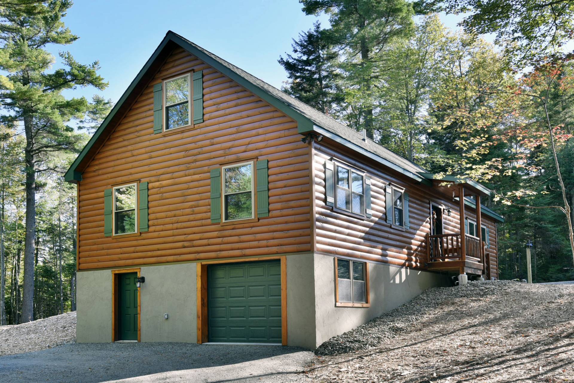 attached garage under multi story log cabin Cozy Cabins, LLC