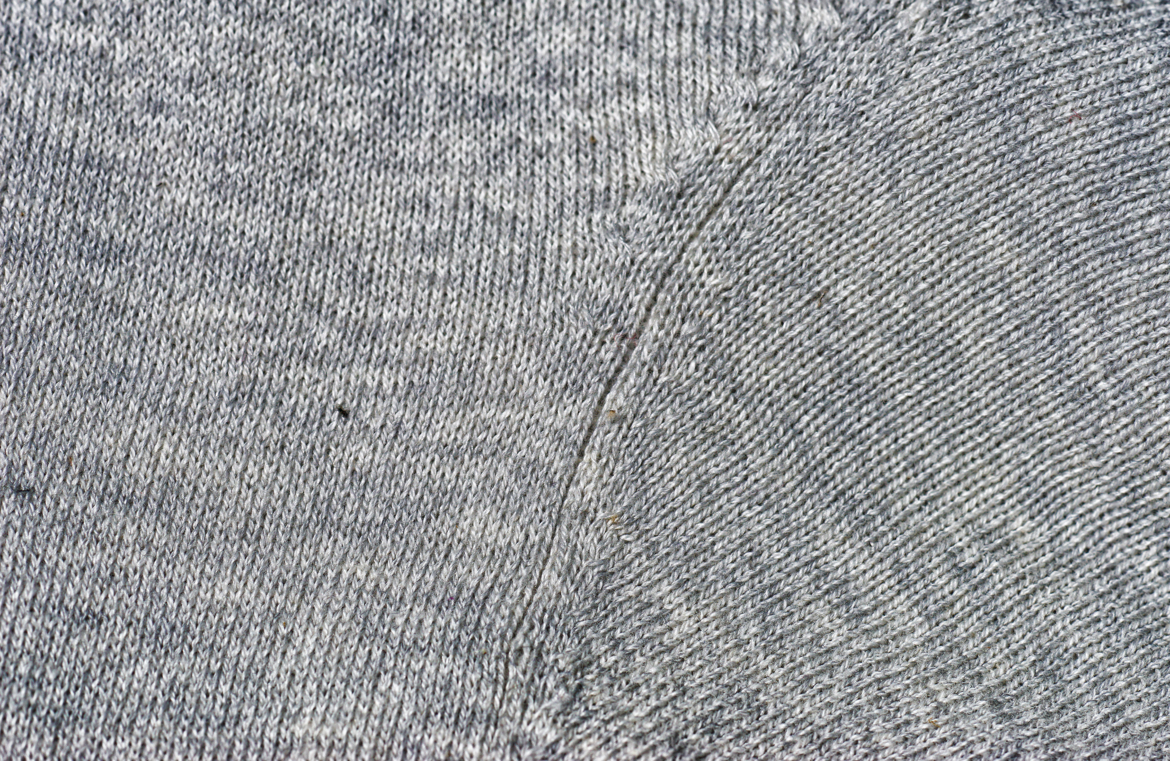 Two grey backgrounds of knit wool fabric textures
