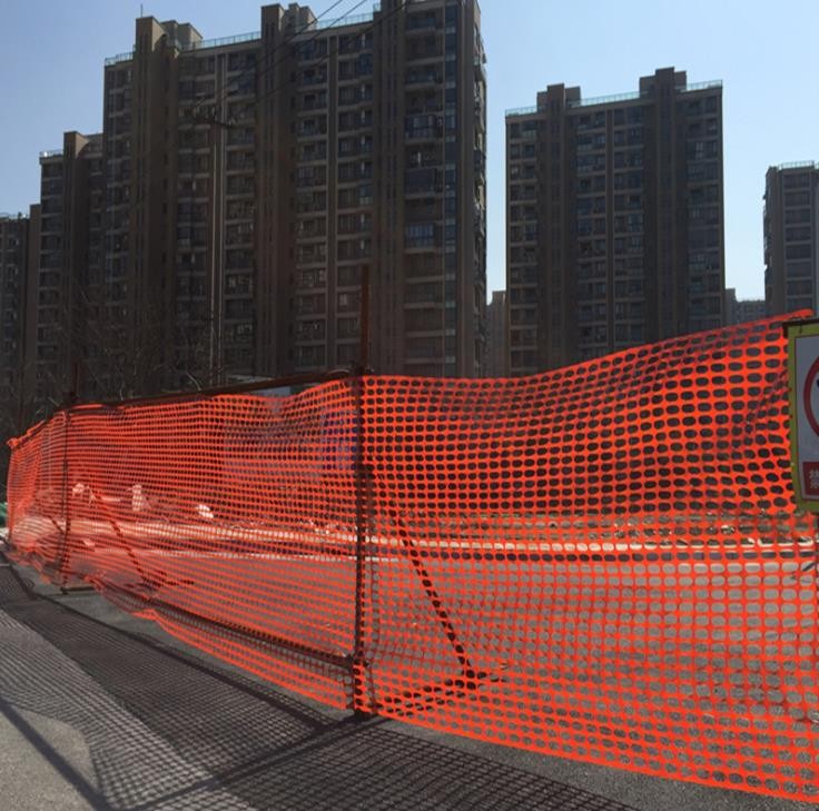 Orange safety barrier mesh fence