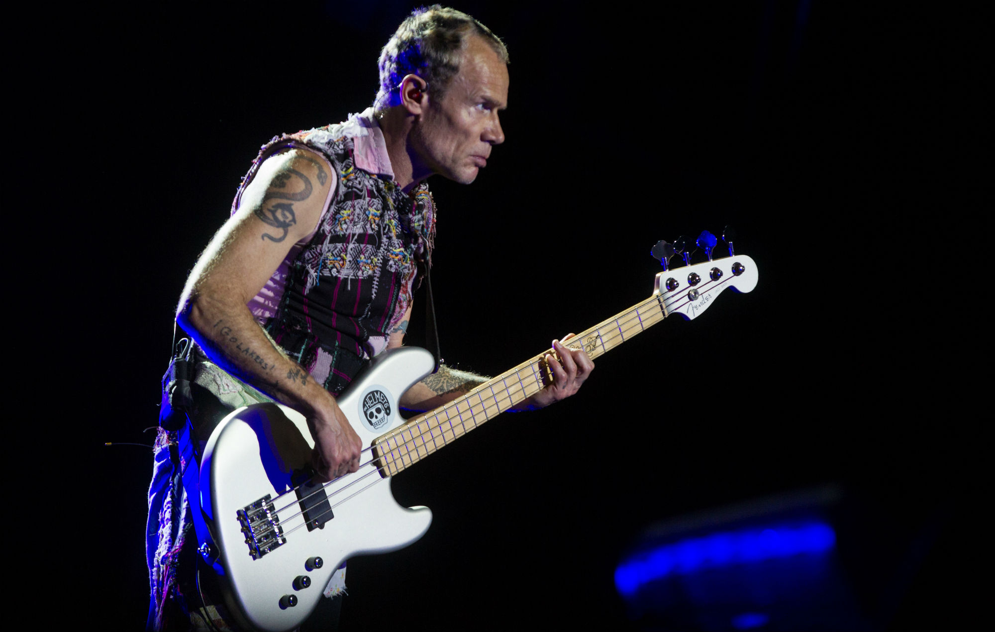 Red Hot Chili Peppers' Flea entertains crowd with handstands as band's