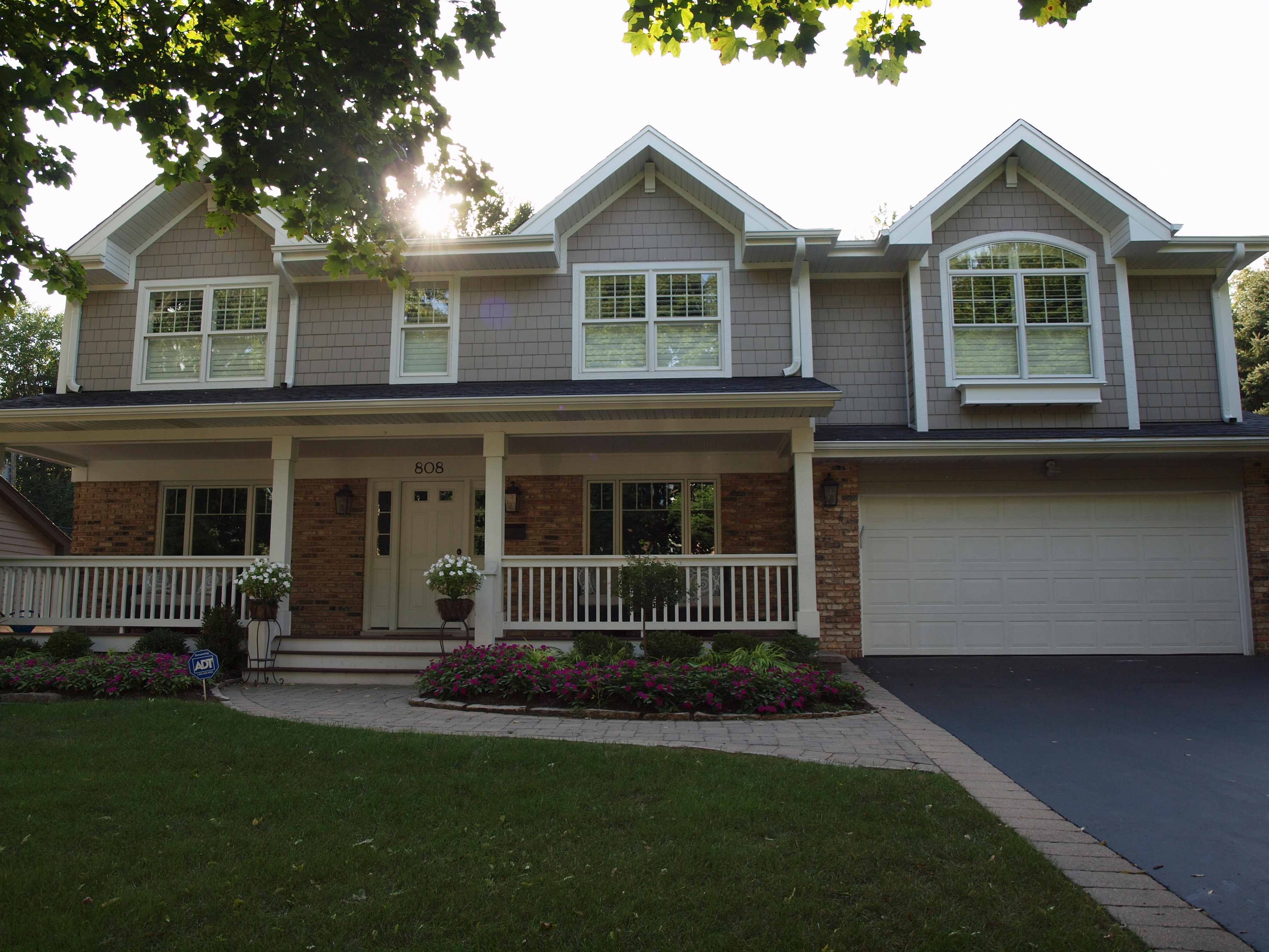 Traditional style home exterior with angled roof lines and front porch