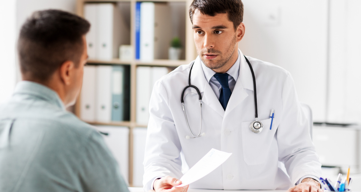 doctor giving prescription to patient at hospital North