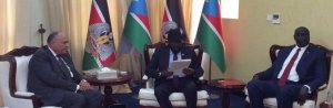 South Sudan troubled President desperately scans through a friendly letter from the Egyptians' president to see his chances of joining the Arab League. Next to the right of Salva Kiir is the Egyptian Foreign Minister Sameh Shukry who brought the letter(Photo: file)