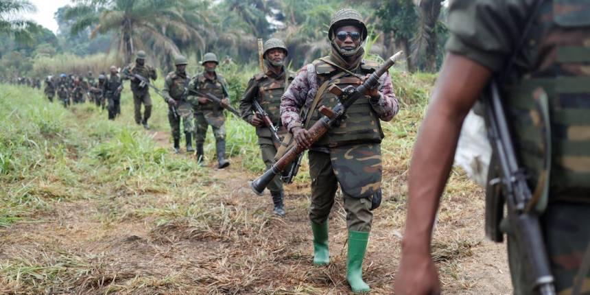 theCongolese soldiers from the Armed Forces of the Democratic Republic of Congo (FARDC) walk in line after the army took over an ADF rebel camp, near the town of Kimbau, North Kivu Province, Democratic Republic of Congo, February 20, 2018(Photo credit: Reuters/Nyamilepedia)